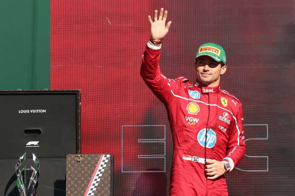 Ferrari driver Charles Leclerc waves to fans on the podium at the 2025 Formula 1 Mexico City Grand Prix