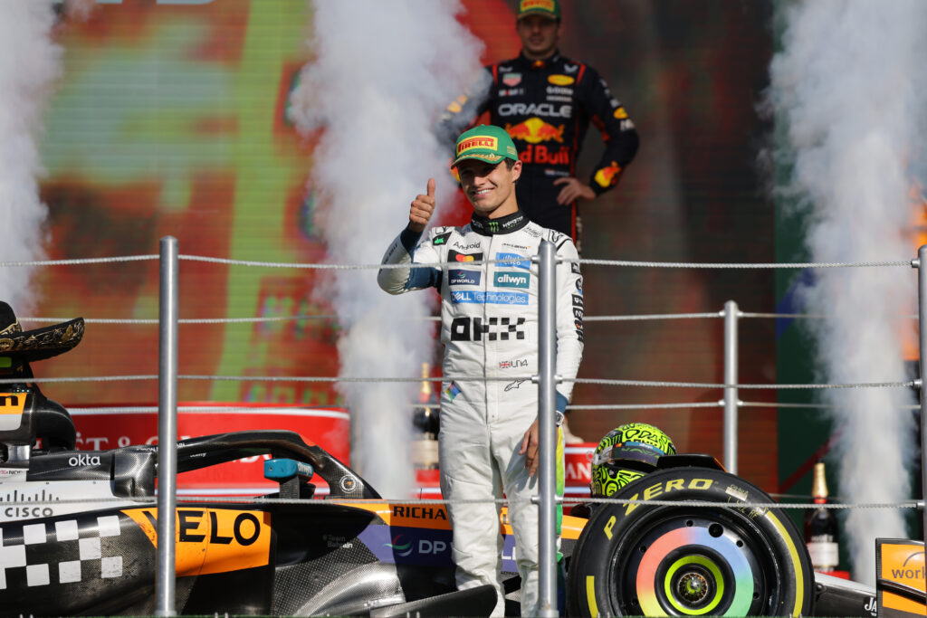 McLaren driver Lando Norris giving a thumbs up on the podium at the 2025 Formula 1 Mexico City Grand Prix