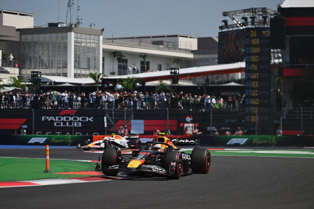 Red Bull driver Yuki Tsunoda racing through the stadium section of the 2025 Formula 1 Mexico City Grand Prix
