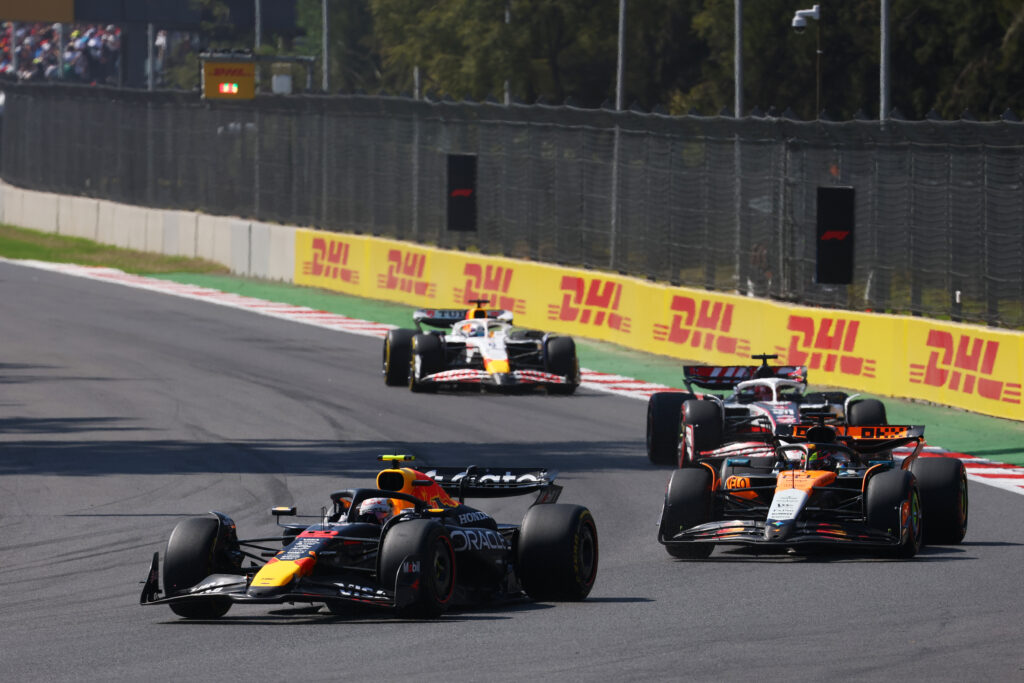 McLaren driver Oscar Piastri on track battling Red Bull's Yuki Tsunoda during the 2025 F1 Mexico City Grand Prix