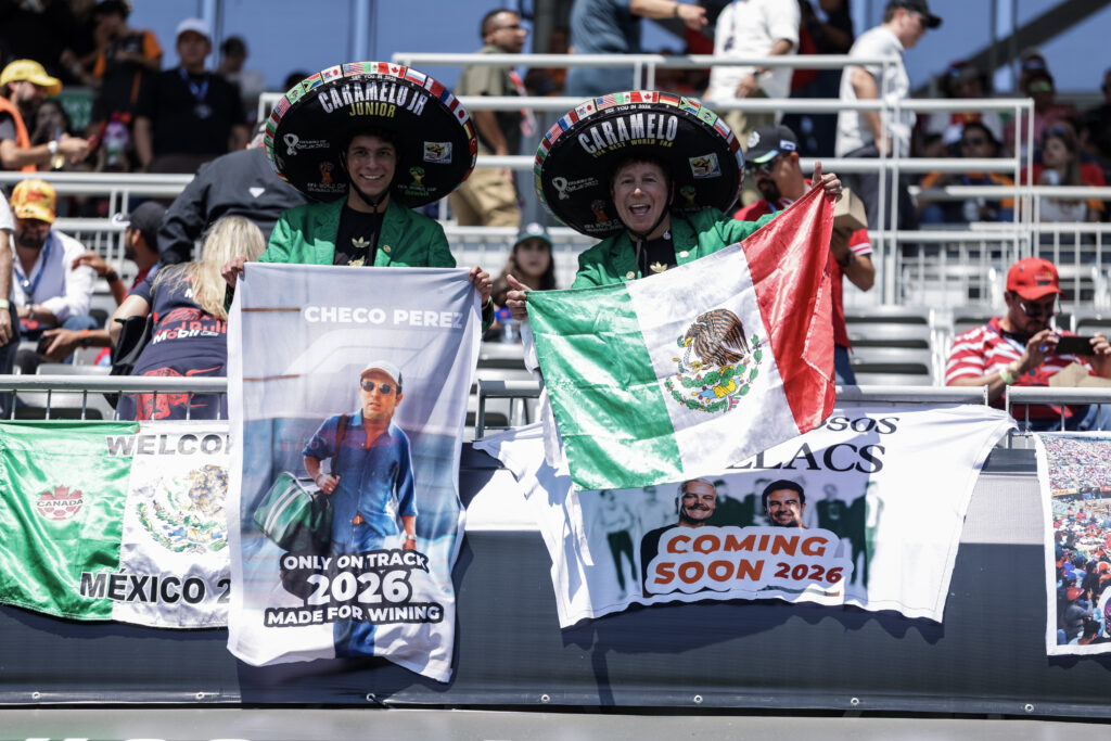 Fans holding flags with Cadillac driver Sergio Perez on them at the 2025 Formula 1 Mexico City Grand Prix