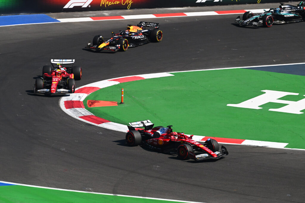 Ferrari driver Charles Leclerc leads teammate Lewis Hamilton on track in the 2025 F1 Mexico City Grand Prix