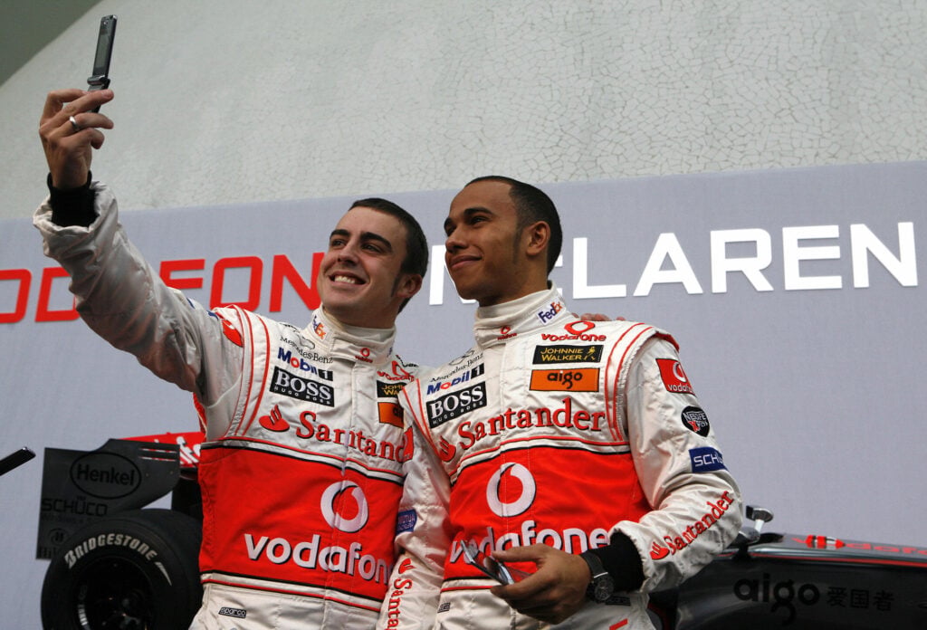 McLaren drivers Fernando Alonso and Lewis Hamilton posing for a photo during the 2007 Formula 1 season
