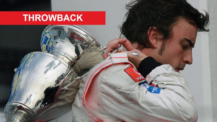 Fernando Alonso of McLaren after the trophy celebration at the 2007 Brazilian Grand Prix, with a Throwback banner