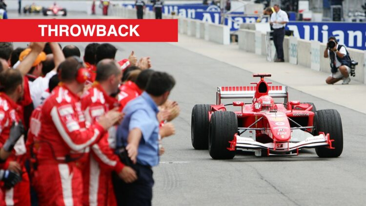 Michael Schumacher being applauded by his Ferrari pit crew at the 2005 United States Grand Prix