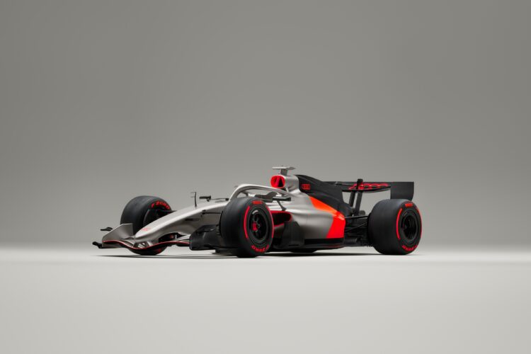 Angled shot of the Audi R26 Formula 1 car on a grey background