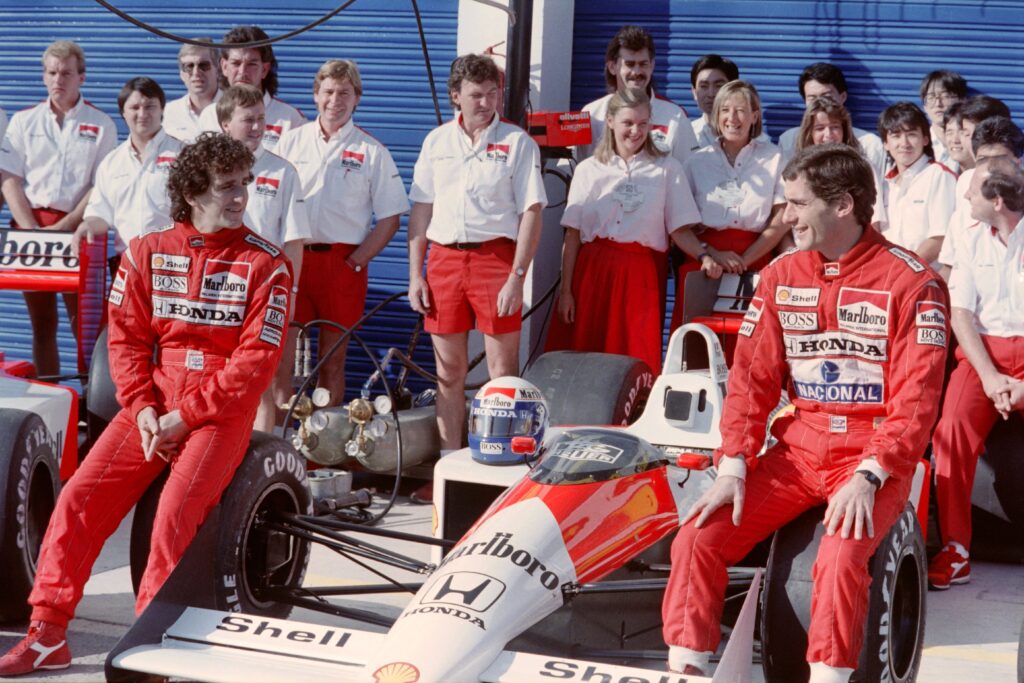 McLaren drivers Alain Prost and Ayrton Senna post for a photo at the 1988 F1 Spanish Grand Prix