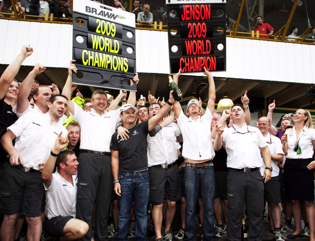 Jenson Button and the Brawn GP team celebrate winning the 2009 F1 drivers' and constructors' titles after the Brazilian Grand Prix