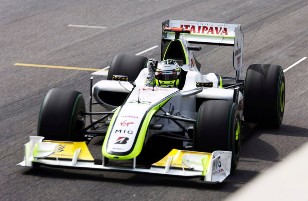 Jenson Button crosses the finish line to win the 2009 F1 drivers' title for Brawn GP at the Brazilian Grand Prix