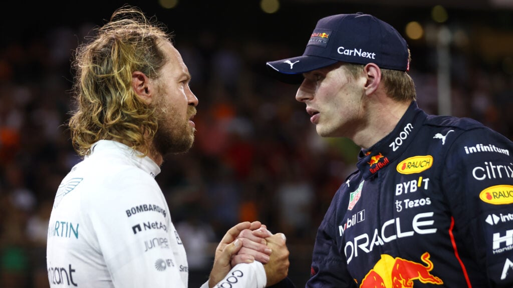 Sebastian Vettel and Max Verstappen speak in parc ferme after the 2022 F1 Abu Dhabi Grand Prix