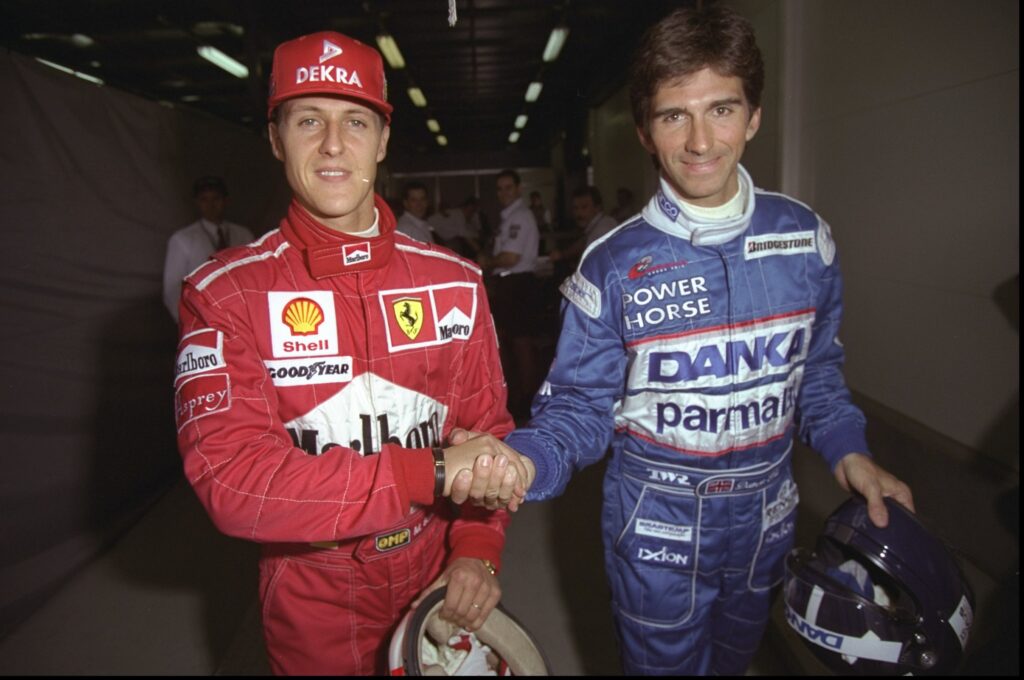 Ferrari driver Michael Schumacher shaking hands with Williams driver Damon Hill before the 1997 Formula 1 Australian Grand Prix
