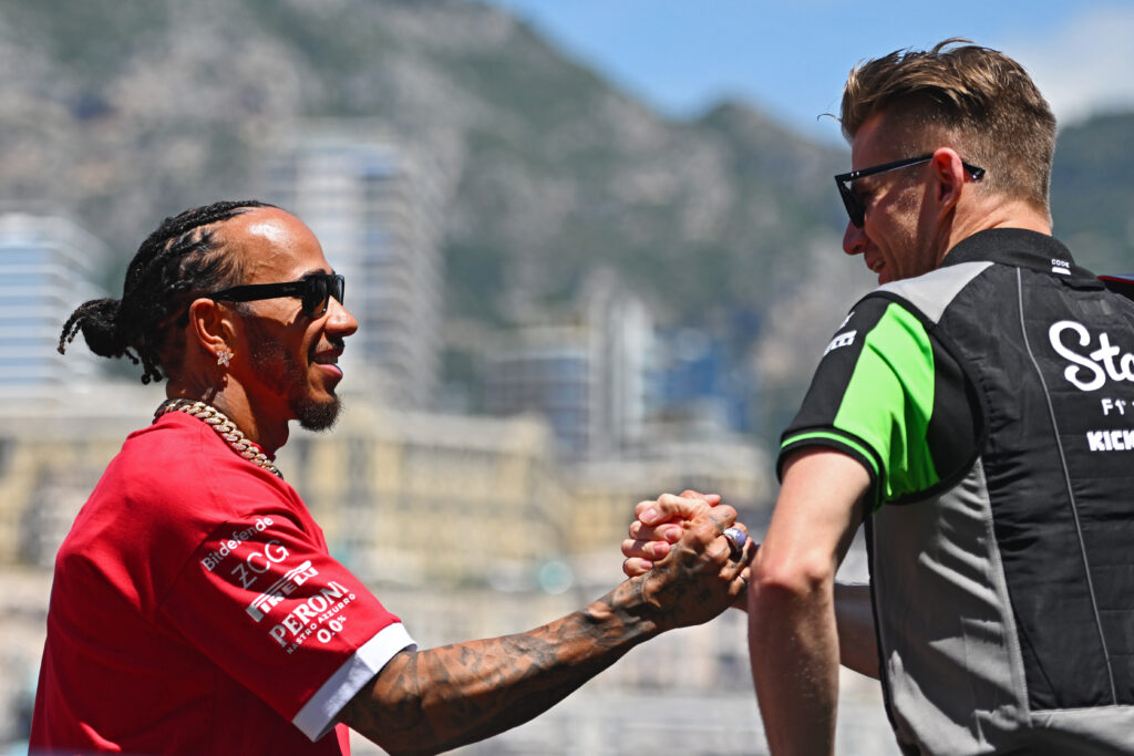 Lewis Hamilton shaking hands with Nico Hulkenberg at the 2025 Formula 1 Monaco Grand Prix
