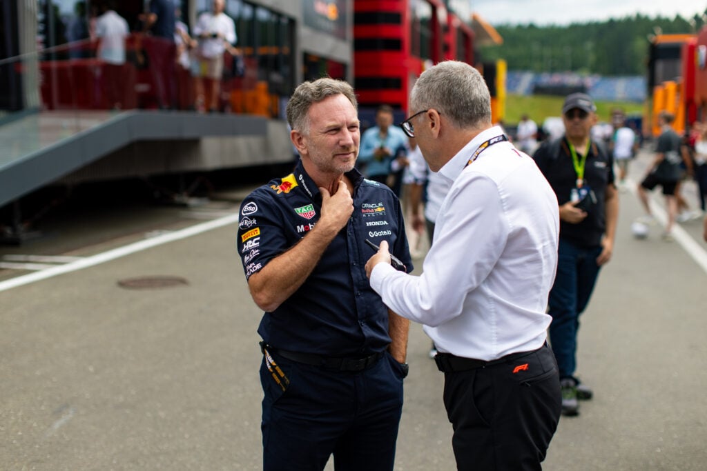 F1 CEO Stefano Domenicali speaks to Christian Horner in the Red Bull Ring paddock ahead of practice at the 2025 F1 Austrian Grand Prix
