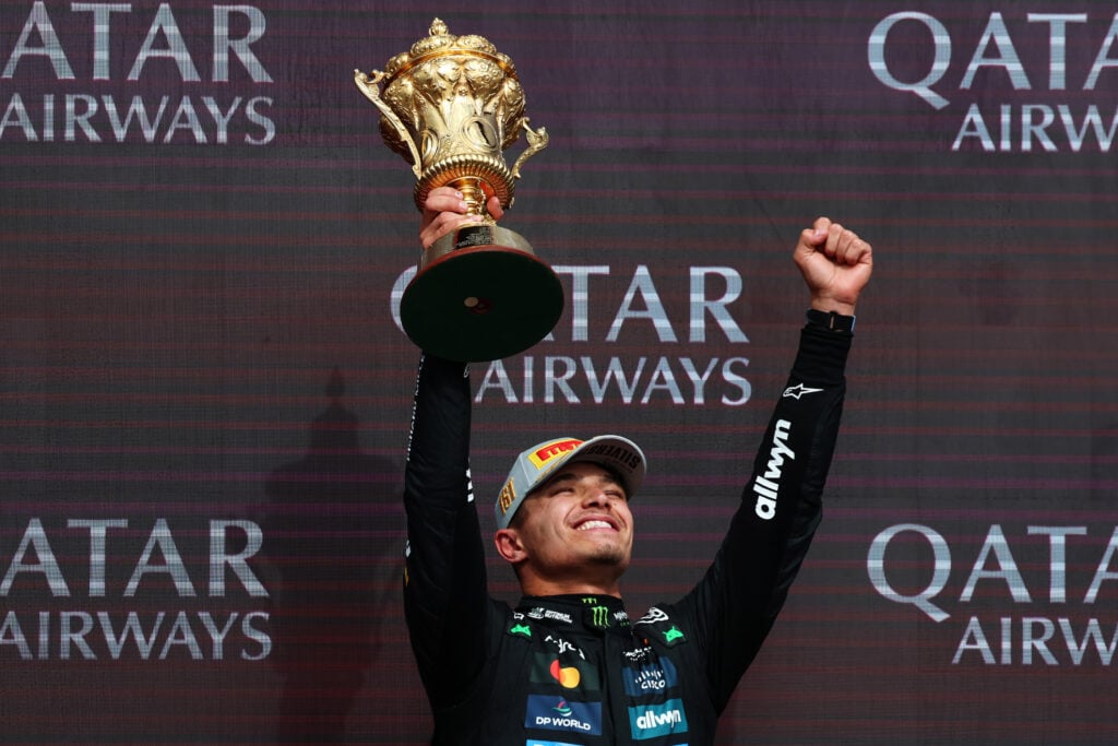 Lando Norris of McLaren celebrates winning the 2025 British Grand Prix at Silverstone with the Royal Automobile Club Trophy