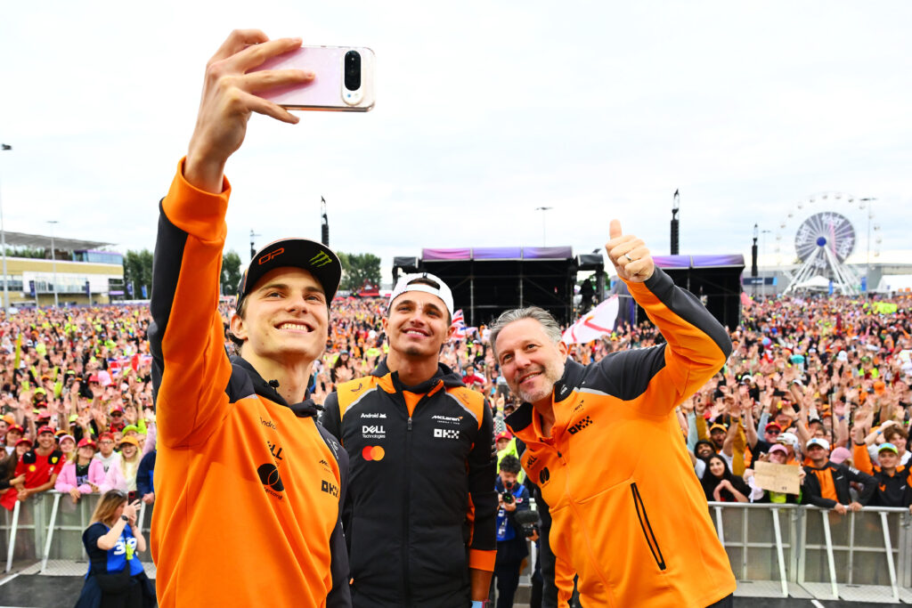 McLaren driver Oscar Piastri taking a selfie with Lando Norris and Zak Brown at the 2025 Formula 1 British Grand Prix
