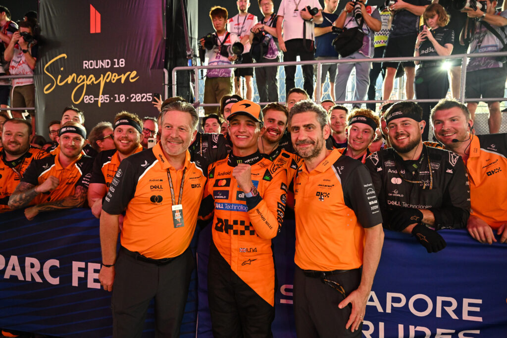 McLaren driver Lando Norris with Zak Brown and Andrea Stella at the 2025 Formula 1 Singapore Grand Prix