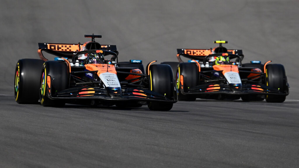 Lando Norris and Oscar Piastri side-by-side in their McLaren F1 cars during Sprint qualifying at the 2025 United States Grand Prix.