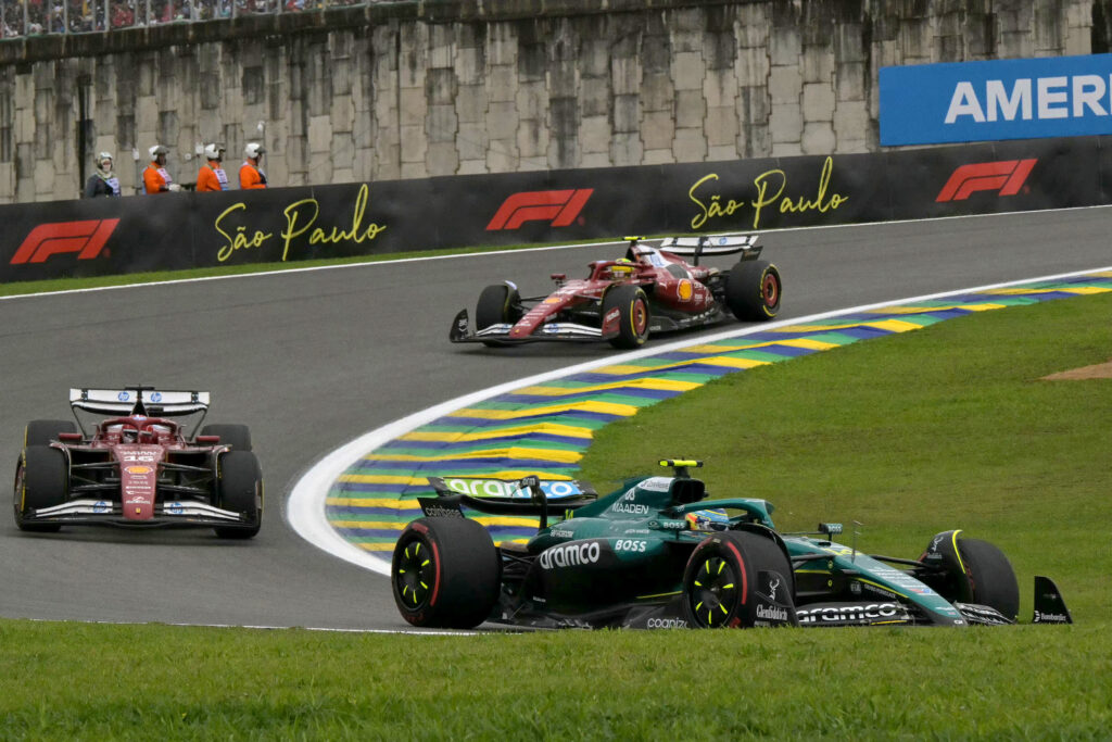 Aston Martin's Fernando Alonso leads Ferrari's Charles Leclerc and Lewis Hamilton on track during the F1 Sprint at the 2025 Sao Paulo Grand Prix