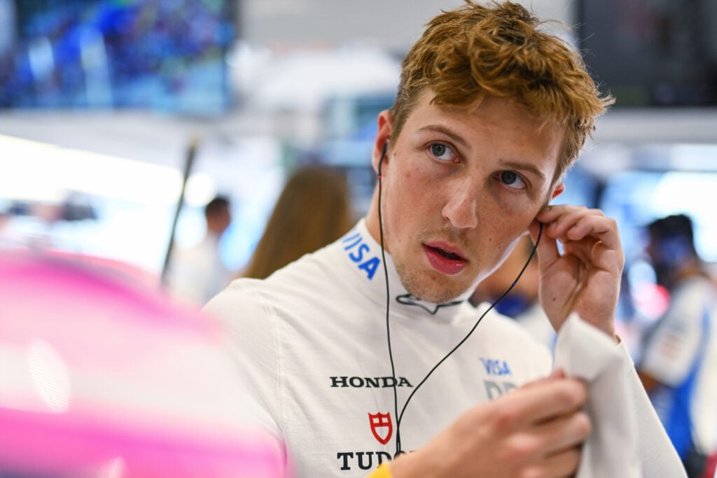 Racing Bulls driver Liam Lawson adjusting his headphones at the 2025 Formula 1 Sao Paulo Grand Prix