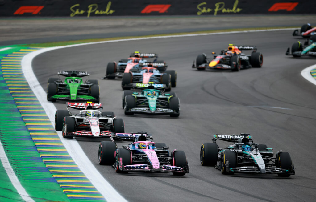 Mercedes driver George Russell fights Alpine's Pierre Gasly at the start of the 2025 F1 Sao Paulo Grand Prix