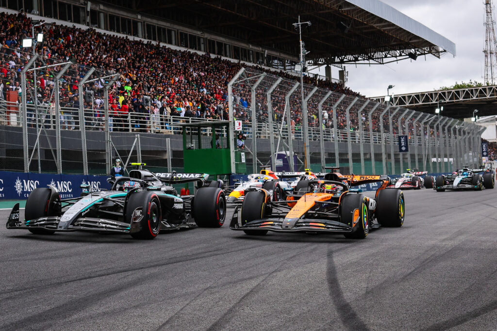 McLaren driver Oscar Piastri driving on the inside of Mercedes driver Andrea Kimi Antonelli at the 2025 Formula 1 Sao Paulo Grand Prix