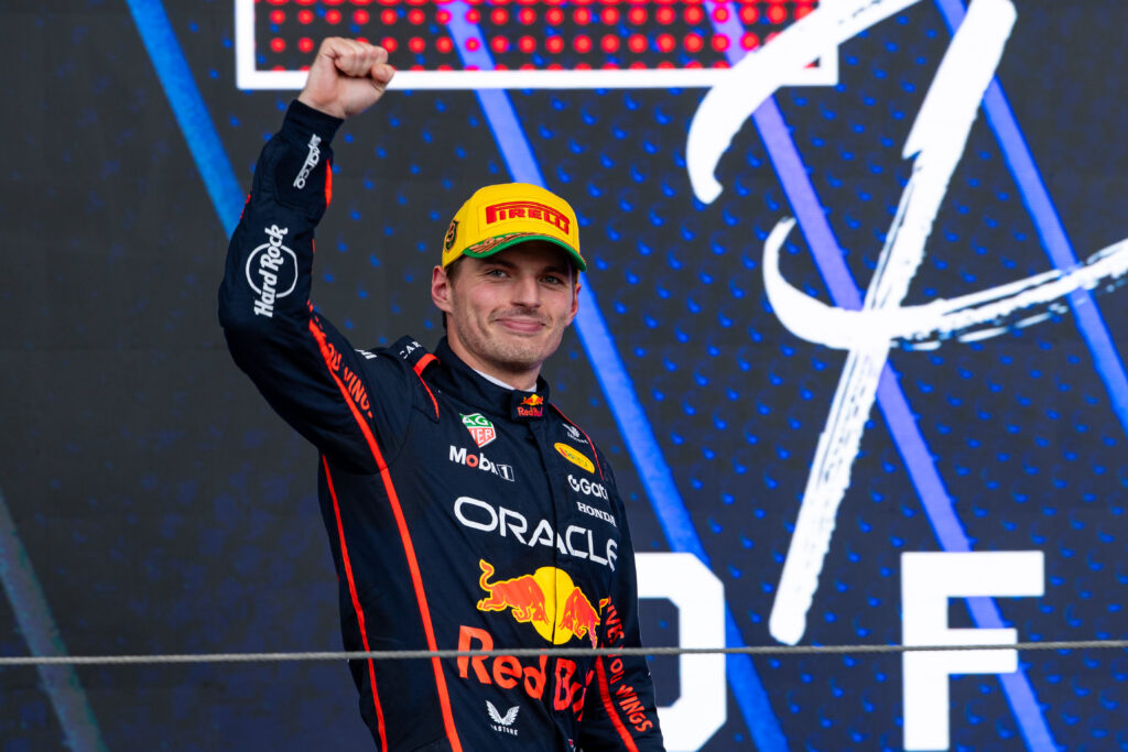 Red Bull driver Max Verstappen celebrating on the podium at the 2025 Formula 1 Sao Paulo Grand Prix