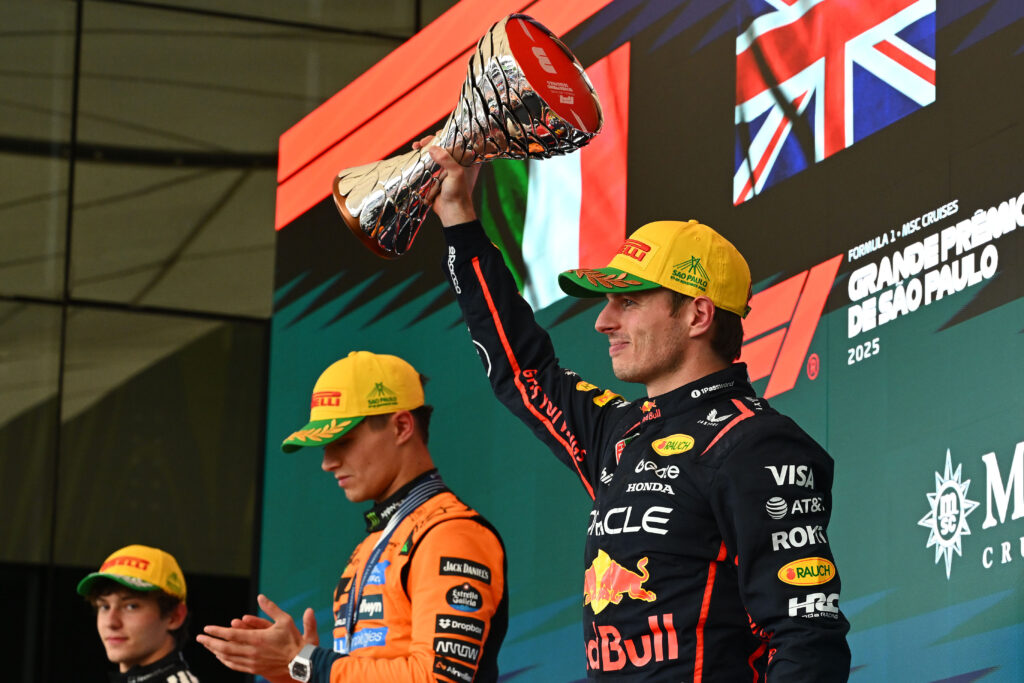 Red Bull driver Max Verstappen lifting his trophy aloft after the 2025 Formula 1 Sao Paulo Grand Prix