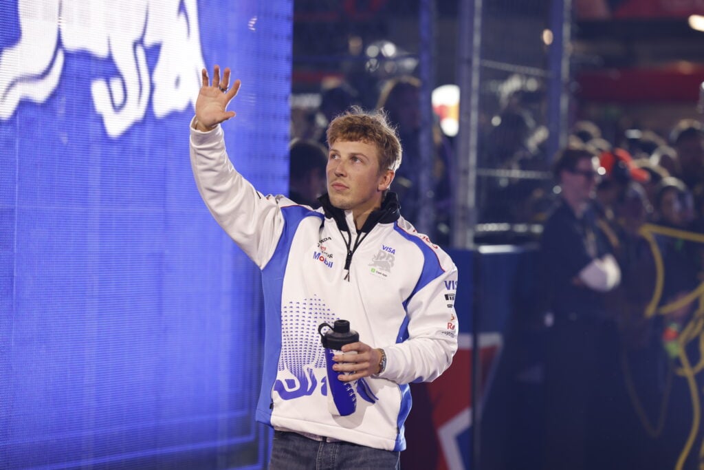 Racing Bulls driver Liam Lawson waving to the crowd at the 2025 Formula 1 Las Vegas Grand Prix