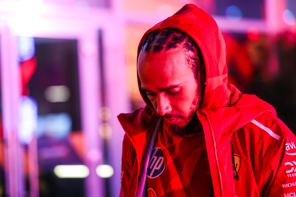 Lewis Hamilton looks down to the ground as he walks through the Las Vegas Grand Prix paddock