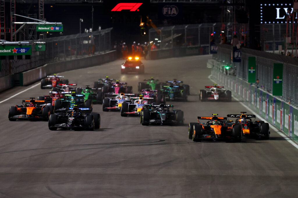McLaren's Lando Norris defends from Red Bull's Max Verstappen at the start of the 2025 F1 Las Vegas Grand Prix before his disqualification