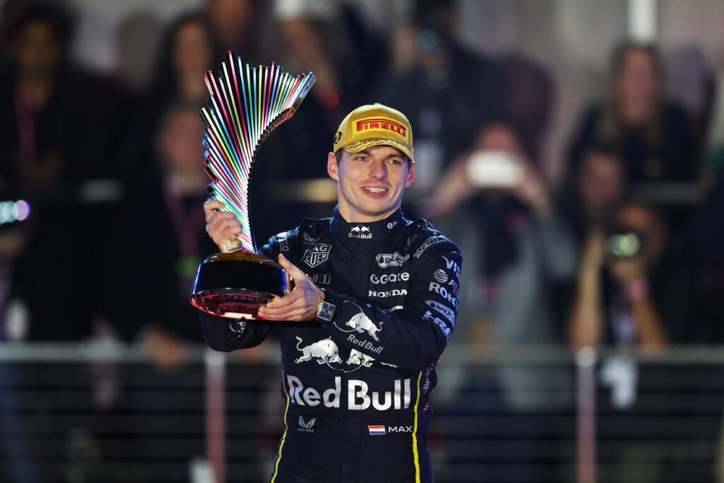 Max Verstappen of Red Bull smiles as he holds up his trophy for winning the Las Vegas Grand Prix