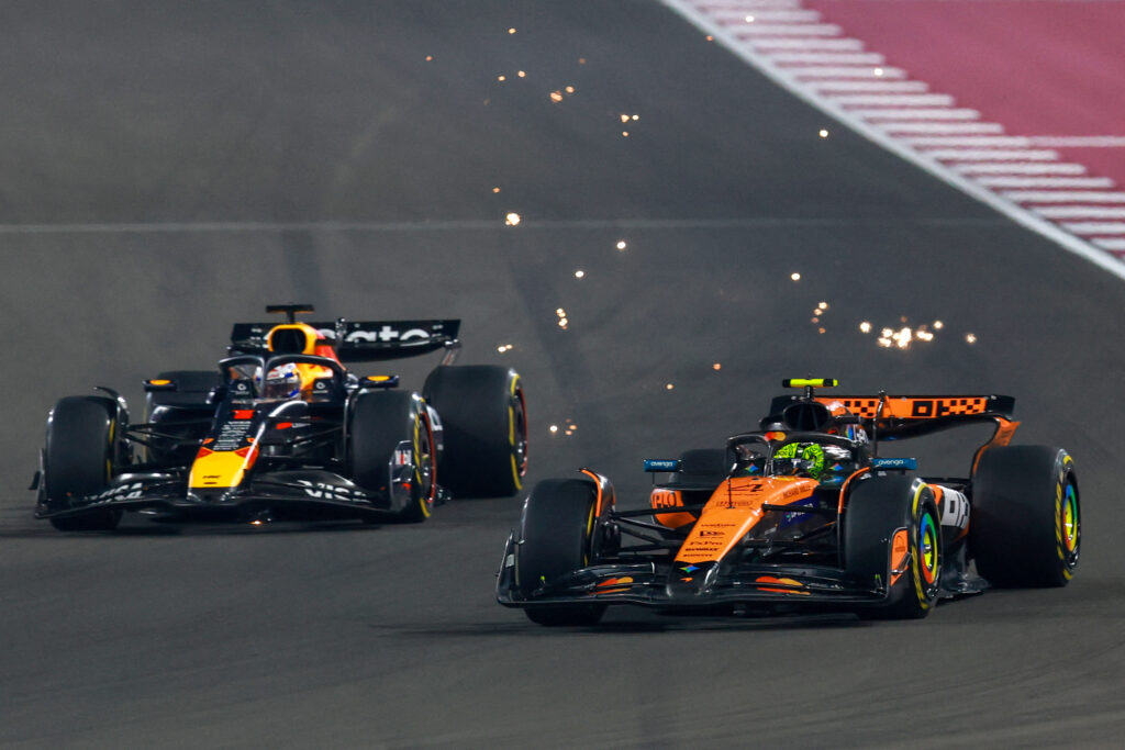 Red Bull driver Max Verstappen on track with McLaren's Lando Norris during the F1 Sprint at the 2025 Qatar Grand Prix