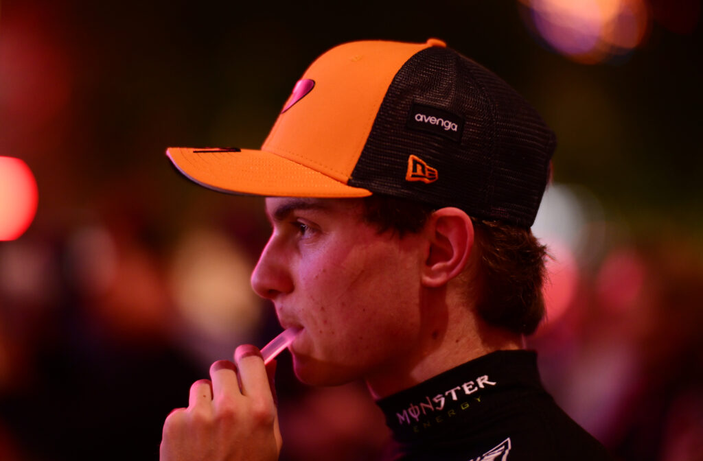 Oscar Piastri drinking out of his water bottle after securing pole position at the 2025 Qatar Grand Prix.
