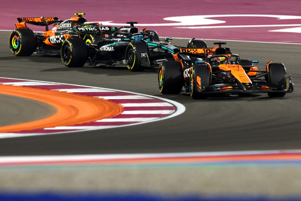 Oscar Piastri leads Mercedes' George Russell and his McLaren teammate Lando Norris on track during the F1 Sprint at the 2025 Qatar Grand Prix