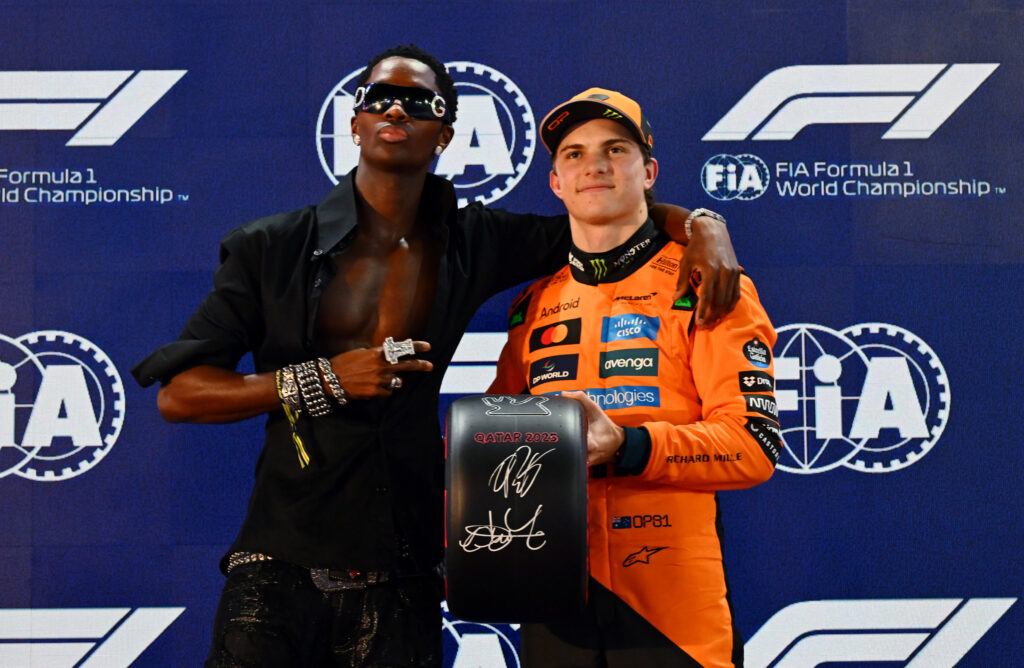 Oscar Piastri poses with the pole position trophy at the Qatar Grand Prix