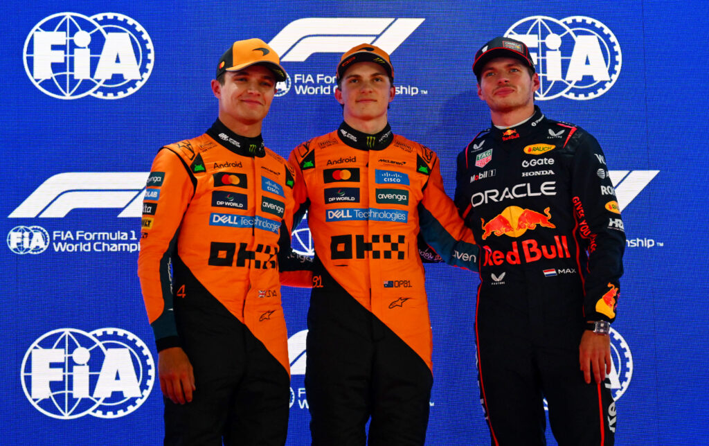 Lando Norris, Oscar Piastri and Max Verstappen pose for photos after the 2025 Qatar Grand Prix qualifying