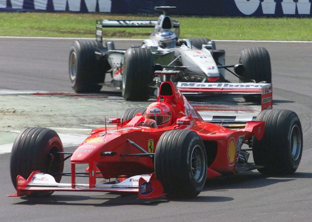 Ferrari driver Michael Schumacher ahead of McLaren driver Mika Hakkinen during the 2000 Italian Grand Prix