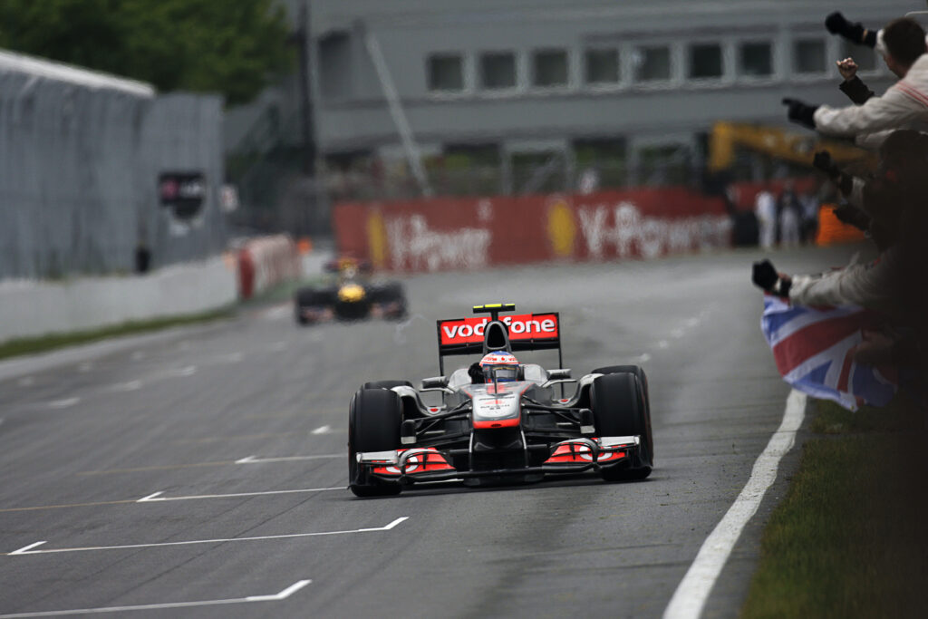 Jenson Button crosses the finish line to win the 2011 F1 Canadian Grand Prix for McLaren