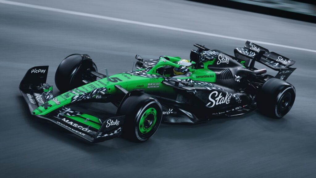 Side-angled image of Gabriel Bortoleto's Sauber F1 car with its Las Vegas livery which is neon green and black with chequered flag accents
