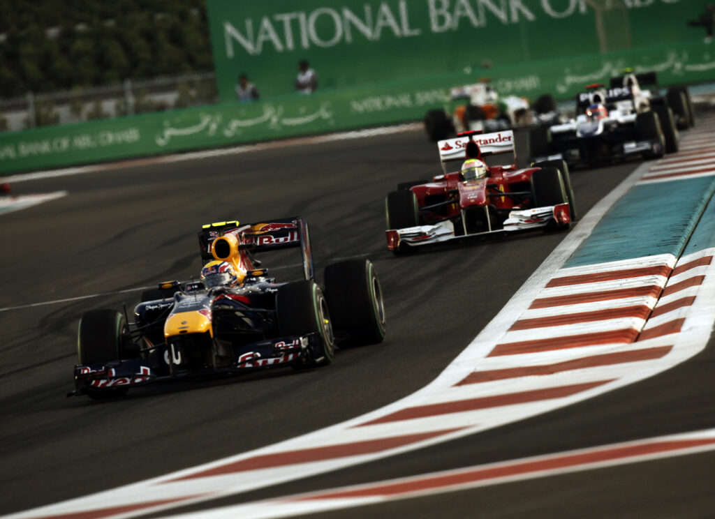 Red Bull driver Mark Webber leads Ferrari's Felipe Massa on track during the 2010 F1 Abu Dhabi Grand Prix