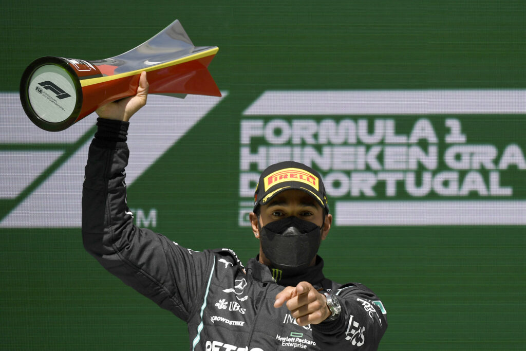 Lewis Hamilton celebrates on the podium after winning the 2021 Portuguese Grand Prix