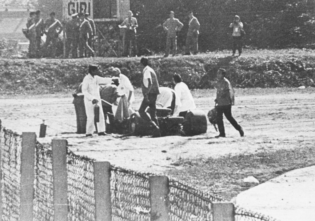 Marshal's surrounding Jochen Rindt's crashed Lotus F1 car after his fatal accident at the 1970 Italian Grand Prix.
