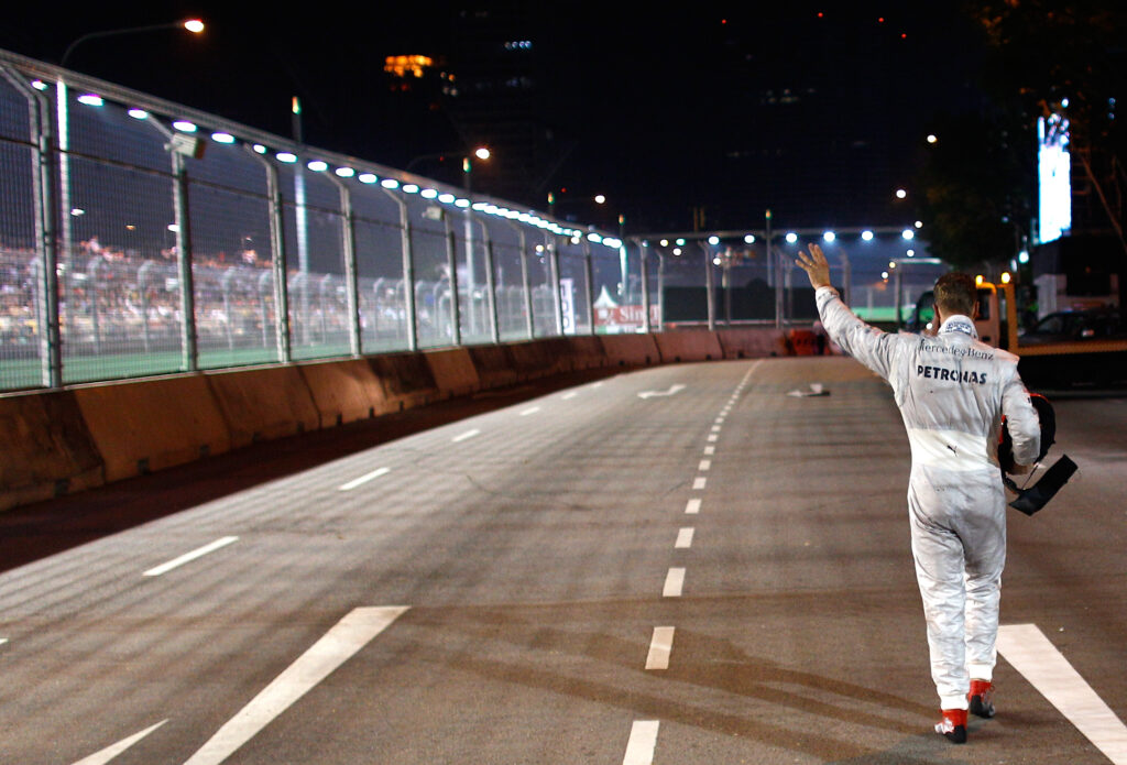 Mercedes driver Michael Schumacher waving to the crowd at the 2012 Singapore Grand Prix
