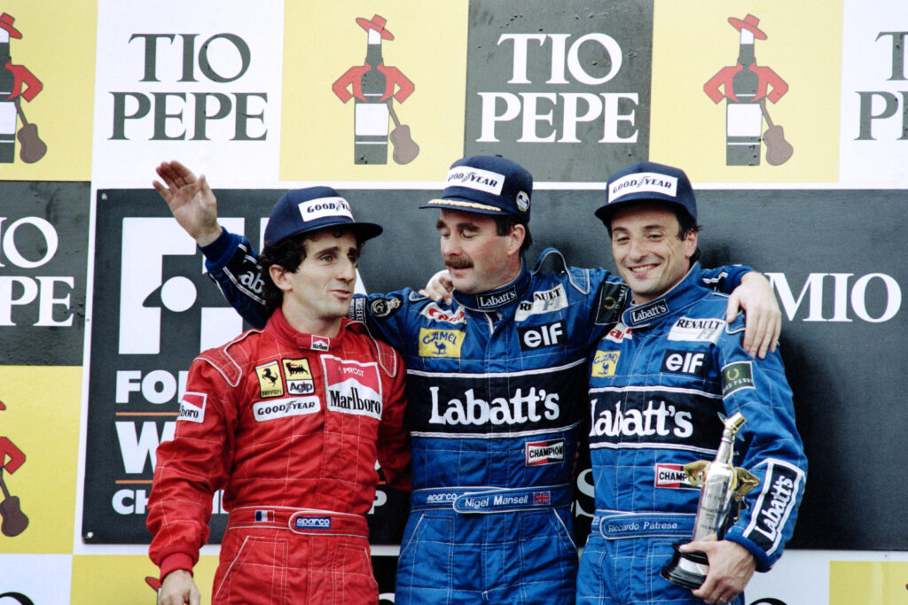 Alain Prost joins Nigel Mansell and Riccardo Patrese on the podium at the 1991 Spanish Grand Prix
