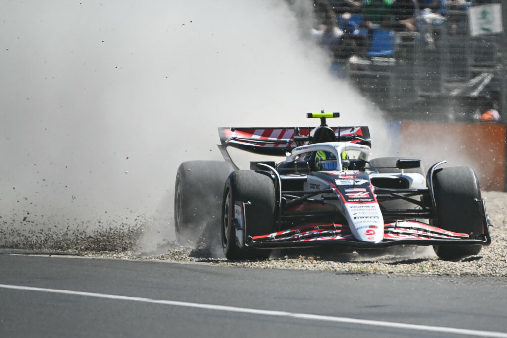 Ollie Bearman's Haas crashing through gravel during the 2025 Australian Grand Prix FP1