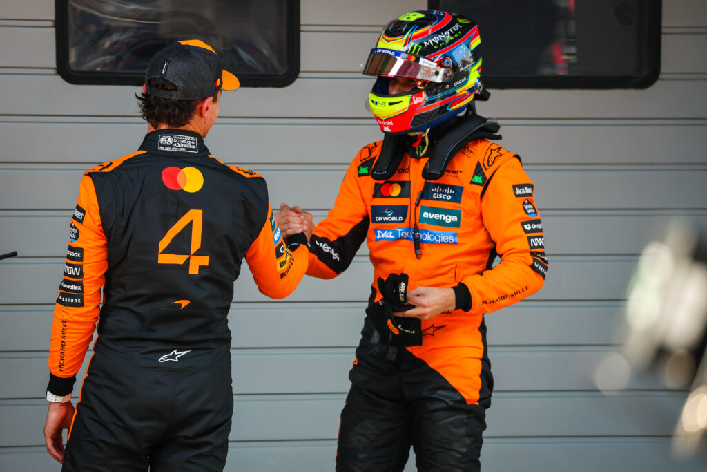 McLaren driver Lando Norris congratulates teammate Oscar Piastri on scoring his first F1 career pole position at the 2025 Chinese Grand Prix