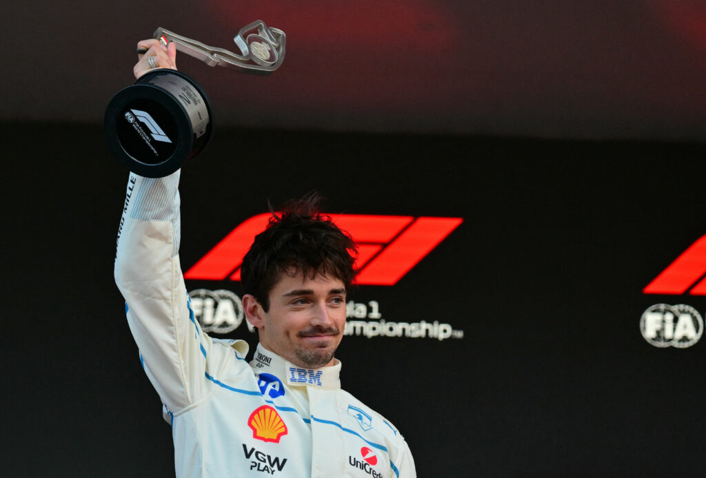 Ferrari driver Charles Leclerc lifts his P2 trophy on the 2025 F1 Monaco Grand Prix podium
