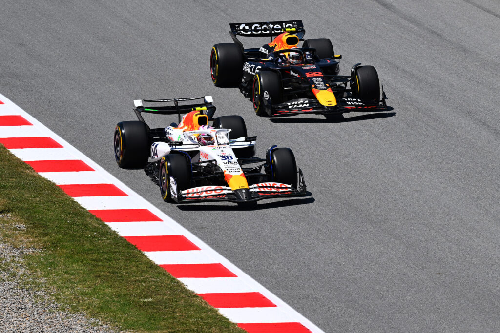 Liam Lawson and Yuki Tsunoda racing at the 2025 Formula 1 Spanish Grand Prix