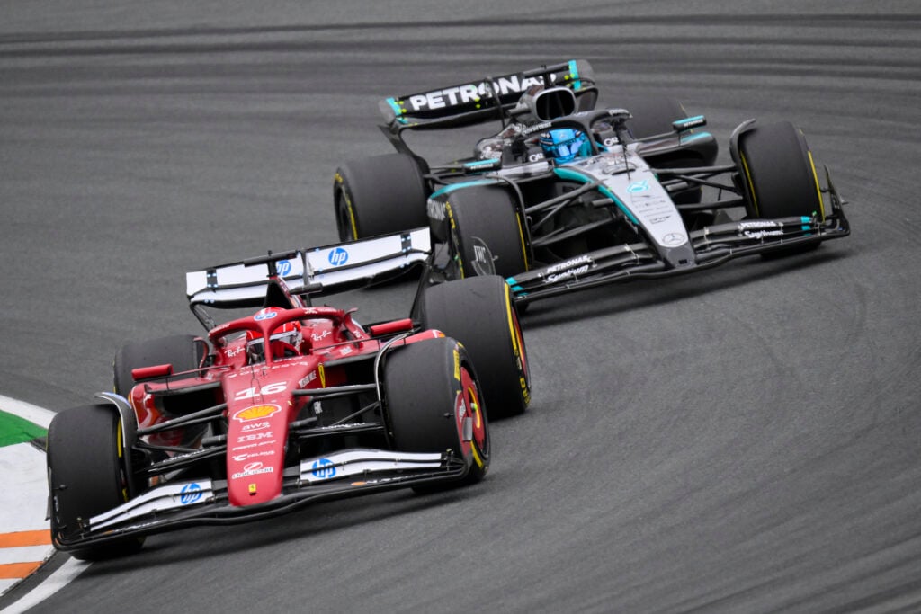 Ferrari driver Charles Leclerc on track with Mercedes' George Russell during the 2025 F1 Dutch Grand Prix