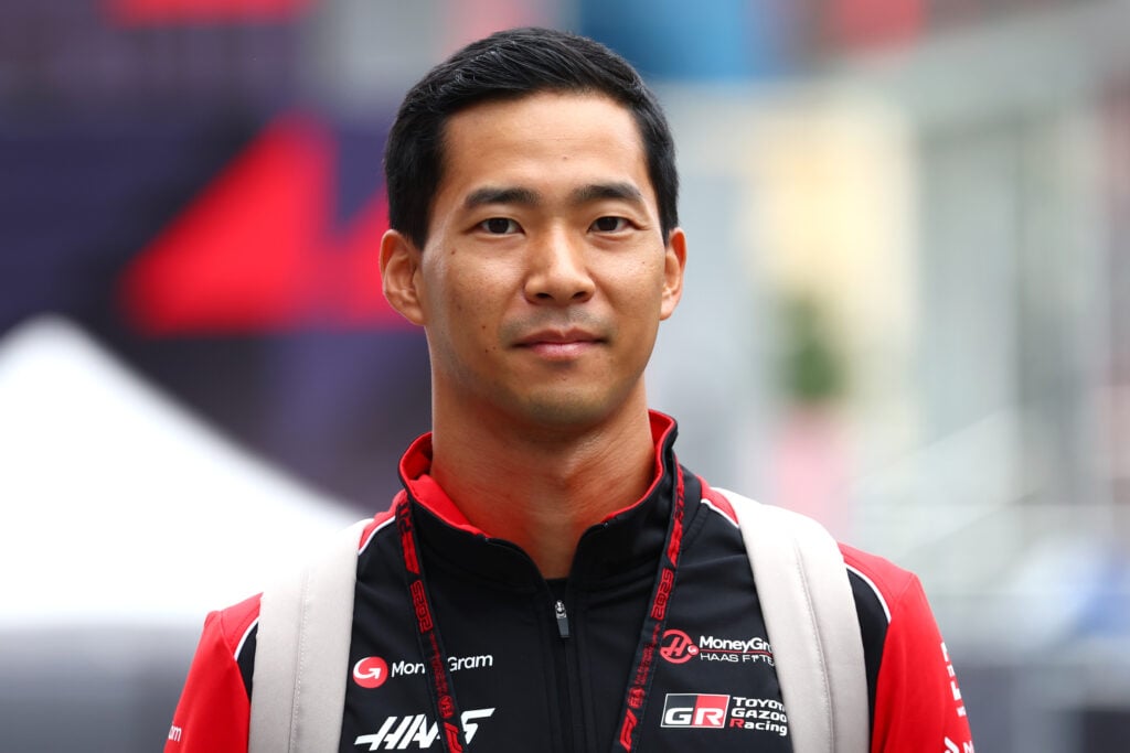 Ryo Hirakawa of Haas walks through the Azerbaijan Grand Prix paddock ahead of his rookie test